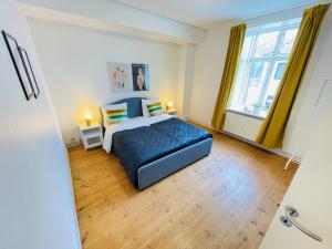 Postel nebo postele na pokoji v ubytování aday - Sunshine apartment in the heart og Hjorring