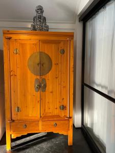 a wooden cabinet with a skeleton on top of it at Ruim vakantie huis Marke Lemselo in de rust en natuur in Weerselo