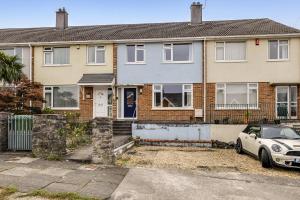 a house with a car parked in front of it at Modern Homely 3 bed in Central Plymouth w parking in Plymouth