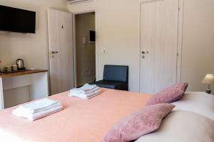 Postel nebo postele na pokoji v ubytování Gennaro Holidays
