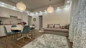 a living room with a couch and a table at Buda Garden Apartment in Budapest