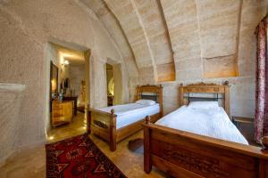 Postel nebo postele na pokoji v ubytování Roma Cave Suite