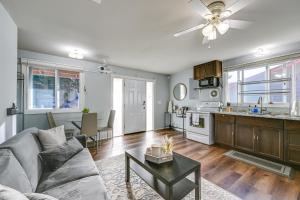 a living room with a couch and a table at Washington Vacation Rental Near Seattle and Tacoma in Des Moines