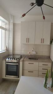 A cozinha ou kitchenette de Aconchegante apt c/ garagem