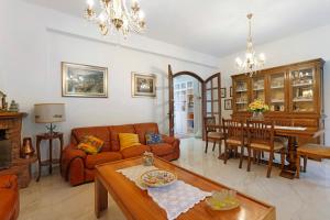 a living room with a couch and a table at Ca' Lina in Licciana Nardi