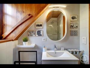 a bathroom with a sink and a mirror at CASA DEL VALLE de Alma de Nieve in Tredós +36 photos
