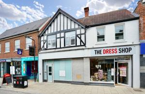 a dress shop on a street in a town at Huntingdon Luxury Apartments in Huntingdon