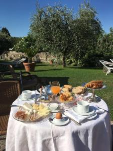 a white table with food and drinks on it at Hotel Ca' Mura in Bardolino