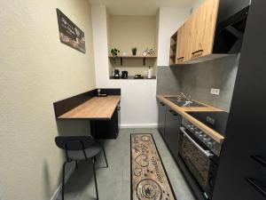 a small kitchen with a counter and a sink at Europa Apartments nähe Düsseldorf Messe, Airport in Krefeld
