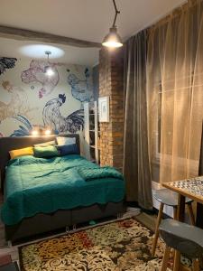 a bedroom with a bed and a wall with animals at Siedlisko Kępina Zdrój in Ostrów +291 photos