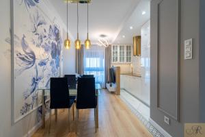 Η κουζίνα ή μικρή κουζίνα στο Apartament Rosa Stacja Mińsk