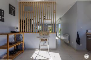 a kitchen with a table in a room at Tri-O-Bois in Thianges
