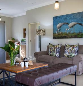 a living room with a couch and a table at Fordoun Hotel and Spa in Nottingham Road