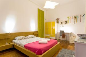 a bedroom with a bed with a pink blanket at Principe Real Orange tree w/ view 3 bedrooms flat! in Lisbon