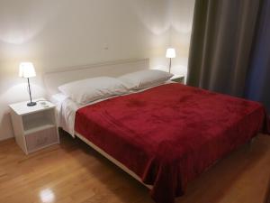 Ένα ή περισσότερα κρεβάτια σε δωμάτιο στο Sunrise Apartment