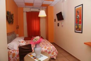 Postel nebo postele na pokoji v ubytování Oasi B&B