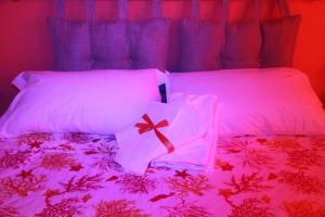 Postel nebo postele na pokoji v ubytování Oasi B&B