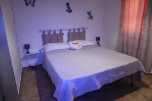 Postel nebo postele na pokoji v ubytování Oasi B&B