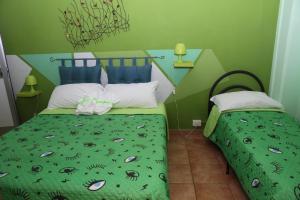 Postel nebo postele na pokoji v ubytování Oasi B&B