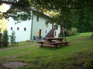 a house with a picnic table in front of it at Pension U Štěpánků in Trpišovice