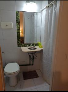 a bathroom with a toilet and a sink and a mirror at AGRADABLE STUDIO EN PALERMO in Buenos Aires