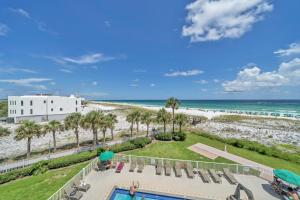 a view of the beach from the balcony of a resort at Destin on the Gulf 403 - This is a beautiful beach front condo with a great view of the gulf in Destin