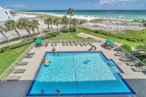 an overhead view of a swimming pool and the beach at Destin on the Gulf 403 - This is a beautiful beach front condo with a great view of the gulf in Destin