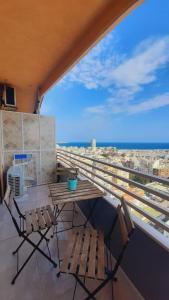 a table and chairs on a balcony with a view at GLP RISCAL 2 in Alicante