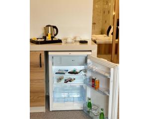 a refrigerator with its door open in a kitchen at OTEL374 in Bolu