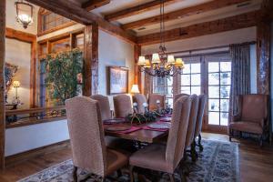 a dining room with a long table and chairs at 866 Bachelor Ridge in Edwards