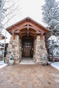 a large stone building with a wooden door at 866 Bachelor Ridge in Edwards