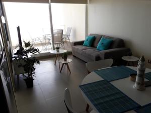 a living room with a couch and a table at Central de Arriendos Nueva Serena in La Serena