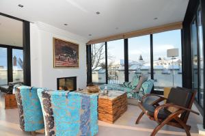 a living room with a couch and a table at Villa Tusculum in Binz in Binz