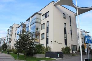 an apartment building on the corner of a street at Vasko luxurious suites, Soilu in Rovaniemi
