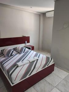 Un pat sau paturi într-o cameră la Hotel Desejo