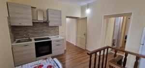 a kitchen with a sink and a stove top oven at Casa Torri in Tarquinia