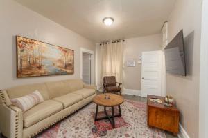 a living room with a couch and a table at Historic 3 Bed 1 bath Near Downtown Spokane in Spokane