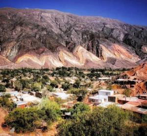 a small town in front of a mountain at Casa Munay in Maimará