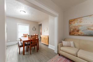 a living room with a table and a couch at Historic 3 Bed 1 bath Near Downtown Spokane in Spokane