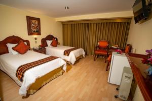 Voodi või voodid majutusasutuse Hotel Agustos Cusco toas