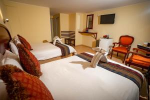 Voodi või voodid majutusasutuse Hotel Agustos Cusco toas