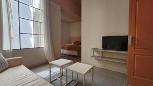 TV a/nebo společenská místnost v ubytování Casa Par Grand Suites