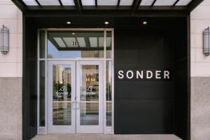 a door to a store with a sign that reads soner at Sonder Gabriel Richard in Detroit