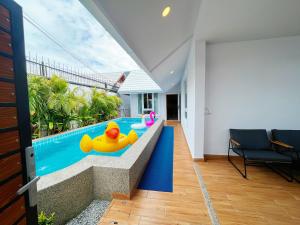 a pool with a rubber duck in the middle of a house at Pattaya Aqua Villa - Pool - Kitchen - BBQ - Smart TV in Pattaya South