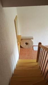 a staircase leading up to a room with a mirror at Ferienhaus Am Stadtpark in Ballenstedt