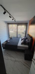 Postelja oz. postelje v sobi nastanitve ITACA apartman Krupanj