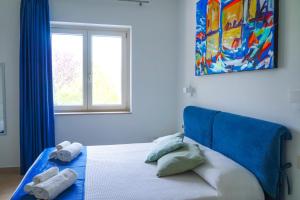 Postel nebo postele na pokoji v ubytování Biancolivo Country House
