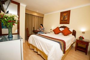 Voodi või voodid majutusasutuse Hotel Agustos Cusco toas
