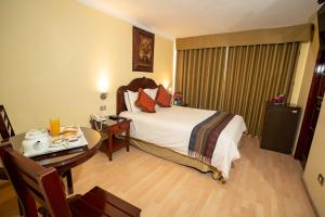 Voodi või voodid majutusasutuse Hotel Agustos Cusco toas