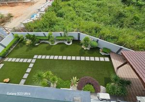 an aerial view of a garden with a lawn and plants at Luxurious Home Villa , Ipoh with Karaoke, Snooker for 15-20 pax in Ipoh